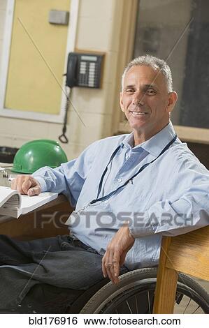 Stock Photograph - Caucasian architect working in office. Fotosearch