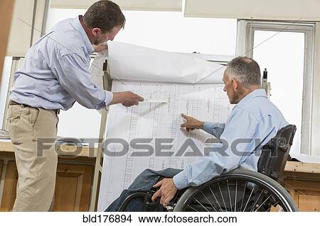 Picture - Caucasian architects talking in office. Fotosearch