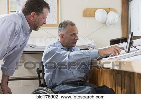 Caucasian architects using digital tablet in office View Large Photo Image Stock Image - Caucasian architects using digital tablet in office. Fotosearch
