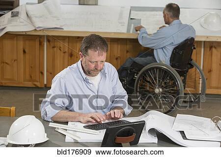 Caucasian architects working in office View Large Photo Image Stock Photo - Caucasian architects working in office. Fotosearch