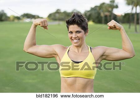 Caucasian athlete flexing outdoors View Large Photo Image Stock Photograph - Caucasian athlete flexing outdoors. Fotosearch
