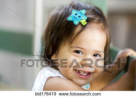 Stock Photo - Caucasian baby girl smiling. Fotosearch