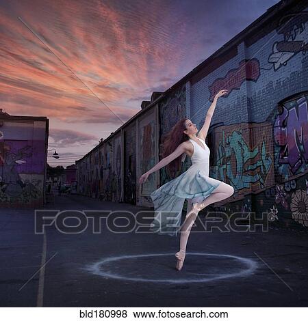 Stock Photo - Caucasian ballerina dancing in circle. Fotosearch