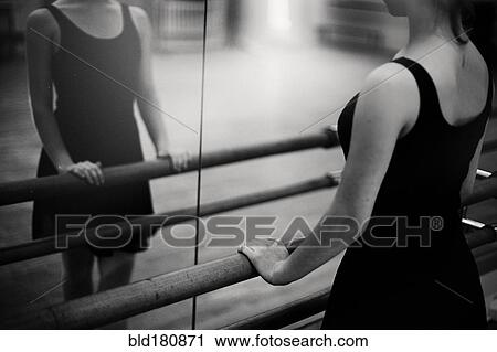 Caucasian ballerina standing at barre View Large Photo Image Stock Image - Caucasian ballerina standing at barre. Fotosearch