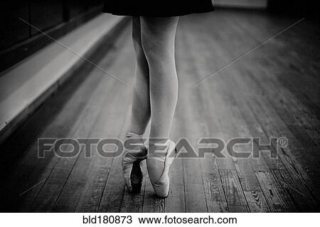 Stock Image - Caucasian ballerina standing on pointe. Fotosearch