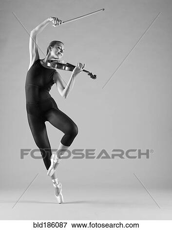 Caucasian ballet dancer playing violin View Large Photo Image Stock Photo - Caucasian ballet dancer playing violin. Fotosearch
