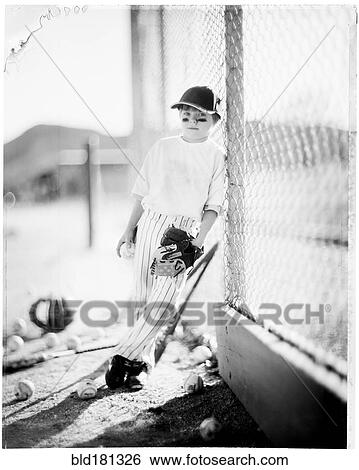 Caucasian baseball player standing on field View Large Photo Image Stock Photograph - Caucasian baseball player standing on field. Fotosearch