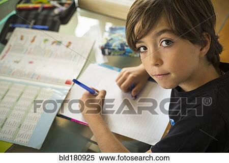 Caucasian boy doing homework View Large Photo Image Stock Photography - Caucasian boy doing homework. Fotosearch