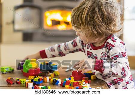 Caucasian boy playing with blocks View Large Photo Image Stock Photograph - Caucasian boy playing with blocks. Fotosearch