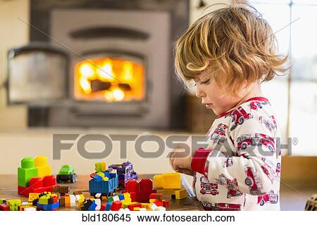 Caucasian boy playing with blocks View Large Photo Image Stock Photography - Caucasian boy playing with blocks. Fotosearch