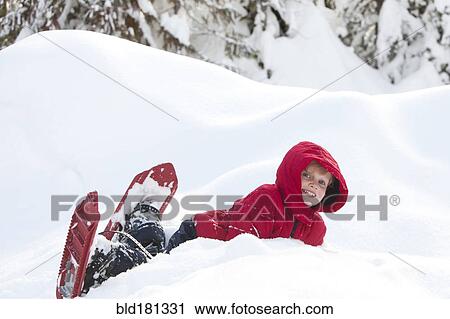 Caucasian boy snowshoeing on hillside View Large Photo Image Stock Image - Caucasian boy snowshoeing on hillside. Fotosearch
