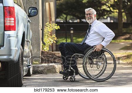 Caucasian businessman in wheelchair at van View Large Photo Image Stock Image - Caucasian businessman in wheelchair at van. Fotosearch