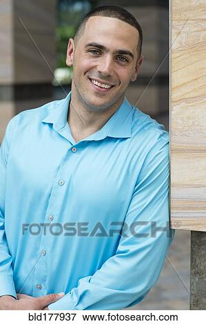 Caucasian businessman smiling outdoors View Large Photo Image Stock Photo - Caucasian businessman smiling outdoors. Fotosearch
