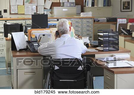 Caucasian businessman talking on phone in office View Large Photo Image Stock Photography - Caucasian businessman talking on phone in office. Fotosearch