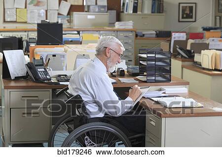 Stock Photograph - Caucasian businessman working in office. Fotosearch