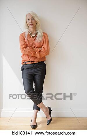 Caucasian businesswoman standing with arms crossed View Large Photo Image Stock Image - Caucasian businesswoman standing with arms crossed. Fotosearch