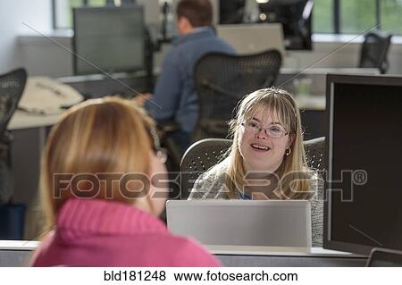 Caucasian businesswomen talking in office View Large Photo Image Stock Photo - Caucasian businesswomen talking in office. Fotosearch