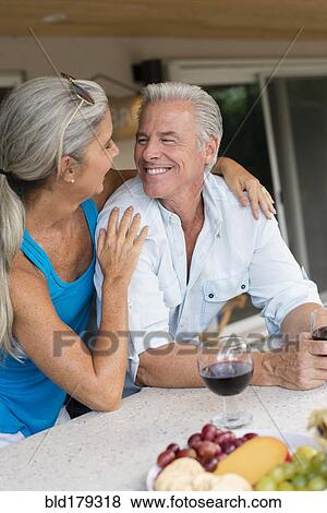 Caucasian couple drinking wine at table View Large Photo Image Stock Photo - Caucasian couple drinking wine at table. Fotosearch