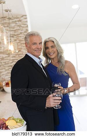 Caucasian couple drinking wine in kitchen View Large Photo Image Stock Image - Caucasian couple drinking wine in kitchen. Fotosearch