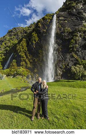 Caucasian couple hugging near remote waterfall View Large Photo Image Stock Image - Caucasian couple hugging near remote waterfall. Fotosearch