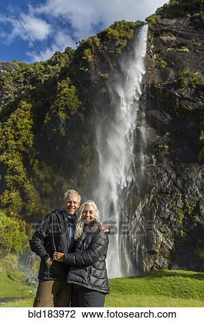 Caucasian couple hugging near remote waterfall View Large Photo Image Stock Image - Caucasian couple hugging near remote waterfall. Fotosearch