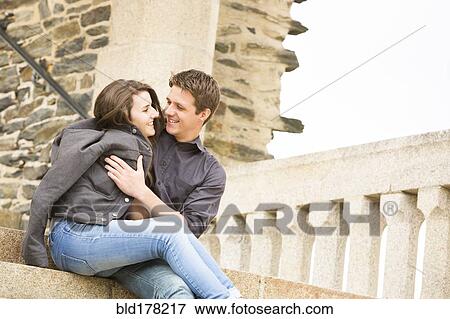 Caucasian couple hugging on castle steps View Large Photo Image Stock Photo - Caucasian couple hugging on castle steps. Fotosearch