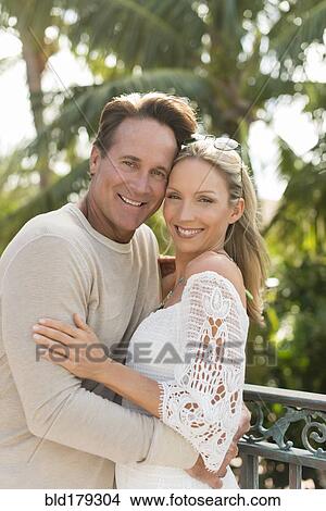 Caucasian couple hugging outdoors View Large Photo Image Picture - Caucasian couple hugging outdoors. Fotosearch