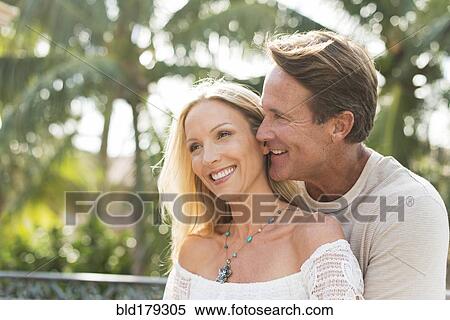 Caucasian couple hugging outdoors View Large Photo Image Stock Photography - Caucasian couple hugging outdoors. Fotosearch