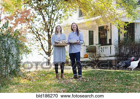Caucasian couple smiling in backyard View Large Photo Image Stock Image - Caucasian couple smiling in backyard. Fotosearch