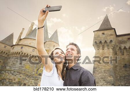 Caucasian couple taking selfie at castle View Large Photo Image Stock Image - Caucasian couple taking selfie at castle. Fotosearch