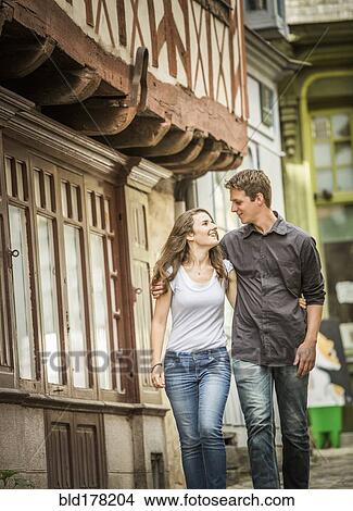 Caucasian couple walking in village View Large Photo Image Picture - Caucasian couple walking in village. Fotosearch