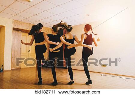 Stock Image - Caucasian dancers practicing in studio. Fotosearch
