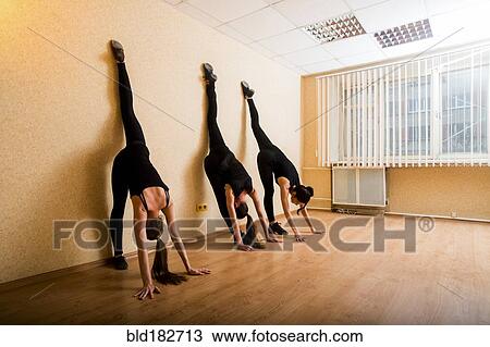 Caucasian dancers stretching in studio View Large Photo Image Stock Image - Caucasian dancers stretching in studio. Fotosearch