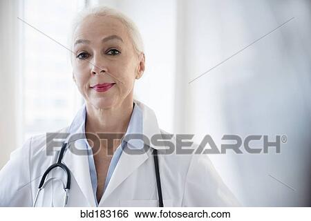 Caucasian doctor wearing stethoscope View Large Photo Image Stock Photograph - Caucasian doctor wearing stethoscope. Fotosearch