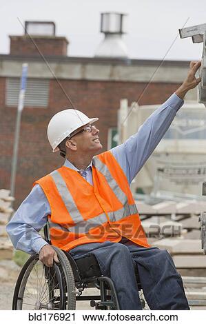 Caucasian engineer working on construction site View Large Photo Image Stock Image - Caucasian engineer working on construction site. Fotosearch