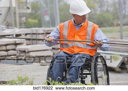 Stock Image - Caucasian engineer working on construction site. Fotosearch