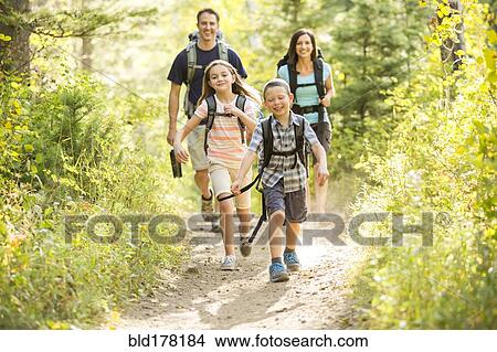 Caucasian family hiking on path View Large Photo Image Picture - Caucasian family hiking on path. Fotosearch