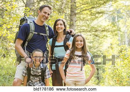 Stock Photograph - Caucasian family hiking. Fotosearch