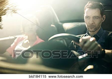 Caucasian father and daughter driving in car View Large Photo Image Stock Photography - Caucasian father and daughter driving in car. Fotosearch