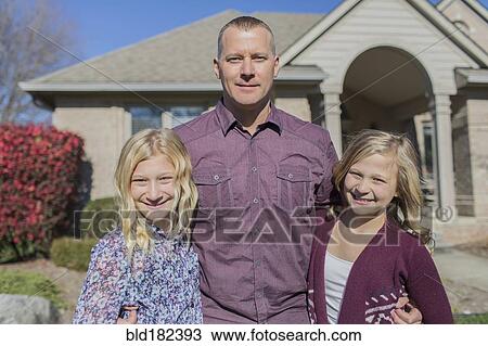 Caucasian father and daughters smiling in yard View Large Photo Image Stock Image - Caucasian father and daughters smiling in yard. Fotosearch