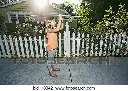 Caucasian girl carrying skateboard on sidewalk View Large Photo Image Stock Image - Caucasian girl carrying skateboard on sidewalk. Fotosearch