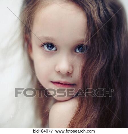 Caucasian girl looking over her shoulder View Large Photo Image Stock Photo - Caucasian girl looking over her shoulder. Fotosearch