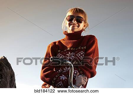 Caucasian girl smiling on bicycle View Large Photo Image Stock Image - Caucasian girl smiling on bicycle. Fotosearch