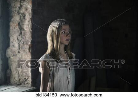 Caucasian girl standing at window View Large Photo Image Stock Image - Caucasian girl standing at window. Fotosearch