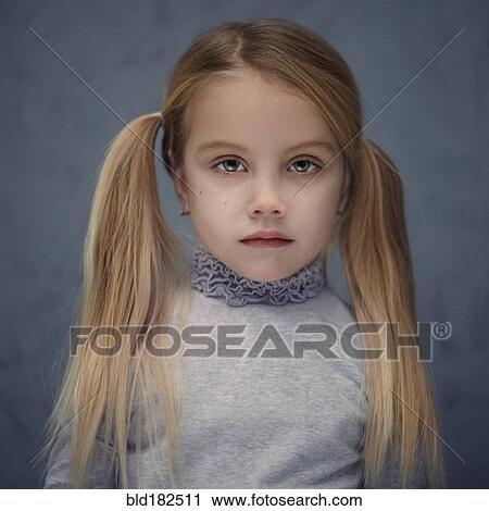 Stock Image - Caucasian girl with pigtails. Fotosearch