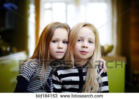 Caucasian girls sitting indoors View Large Photo Image Stock Image - Caucasian girls sitting indoors. Fotosearch