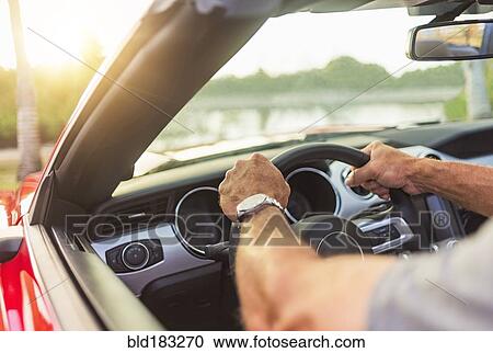 Caucasian man driving convertible View Large Photo Image Stock Image - Caucasian man driving convertible. Fotosearch