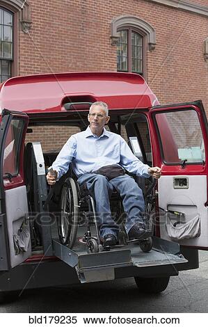 Stock Photography - Caucasian man in wheelchair in accessible van. Fotosearch