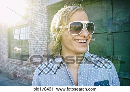 Caucasian man smiling outdoors View Large Photo Image Stock Image - Caucasian man smiling outdoors. Fotosearch