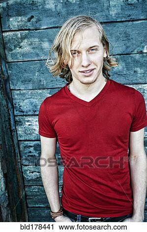 Stock Image - Caucasian man standing outdoors. Fotosearch
